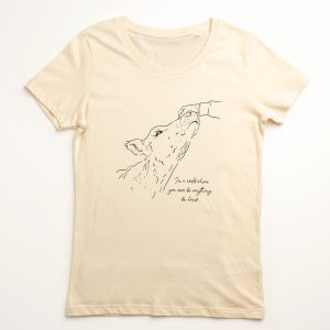 Front image of 'Kindess' tee. Hand patting cow sketch and phrase 'In a world where you can be anything, be kind'